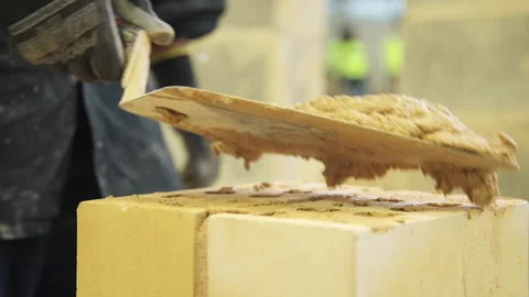 Mortar going on to a housing brick 4k Stock Footage 282631341