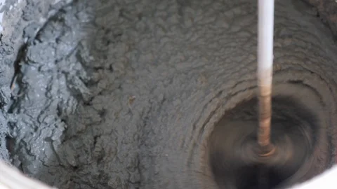 Mortar ingredients mixed in bucket for construction. plaster concrete cement Stock-Footage 113648149