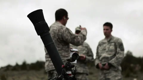 Mortar launcher in foreground with instructor and soldiers in background. Stock Footage 52702954