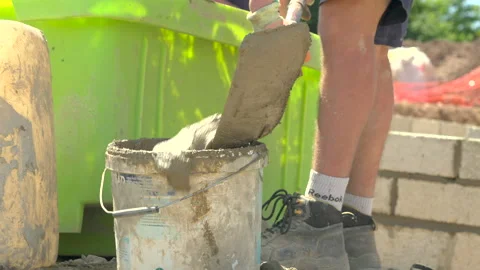 Mortar Put Into Bucket By Labourer Video stock 239686513