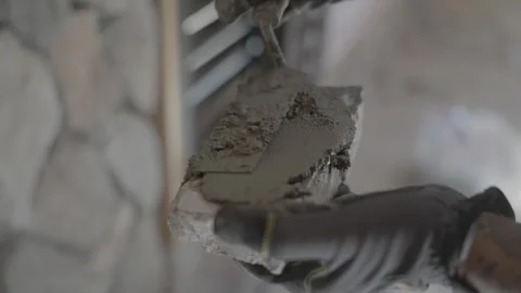 Mortar spread on back of stone veneer Stock Footage 339283898
