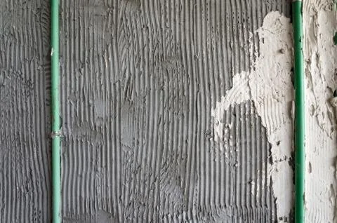 Mortar wall glue plaster comb surface prepared for tiling Stock Photos