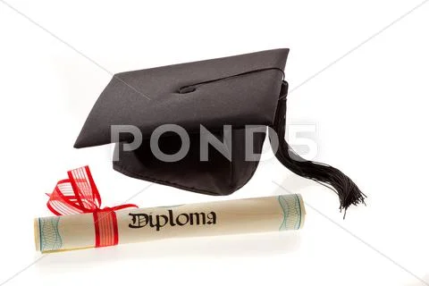 Mortarboard and diploma Stock Photos