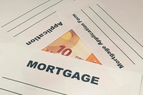 Mortgage application form with money on the table. Stock Photos