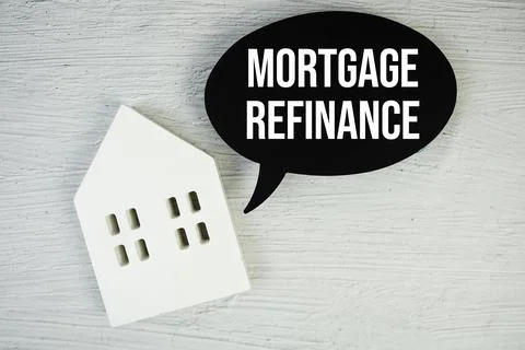 Mortgage Refinance text message on speech bubble with house model on concre.. Stock Photos