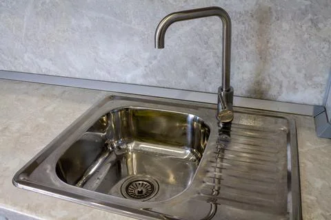 Mortise rectangular stainless steel kitchen sink with faucet Stock Photos