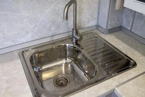Mortise rectangular stainless steel kitchen sink with faucet Stock Photos