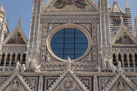 Mosaic And Circular Window on the Facade of Siena Cathedral, Siena, Italy Stock Photos