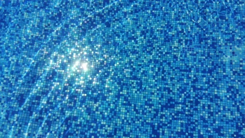 Mosaic bottom of the pool. Abstract blue water background in real time Stock Footage 94546932