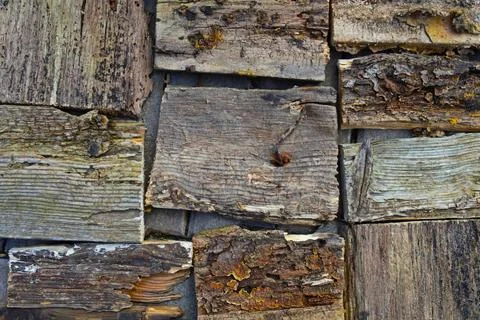 The mosaic is composed of many old half-ruined rotten boards. Stock Photos