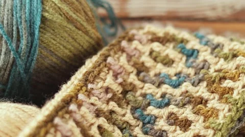 Mosaic Crochet Pattern with Yarn and Hook on Wood Stock Footage 336194954