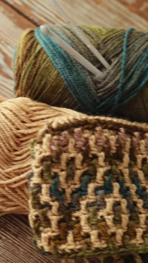 Mosaic Crochet Pattern with Yarn and Hook on Wood Stock Footage 336194976