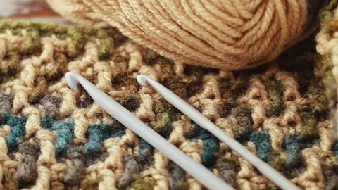 Mosaic Crochet Pattern with Yarn and Hook on Wood Stock Footage 344041849
