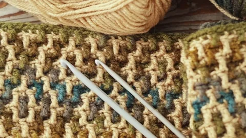 Mosaic Crochet Pattern with Yarn and Hook on Wood Stock Footage 344042034