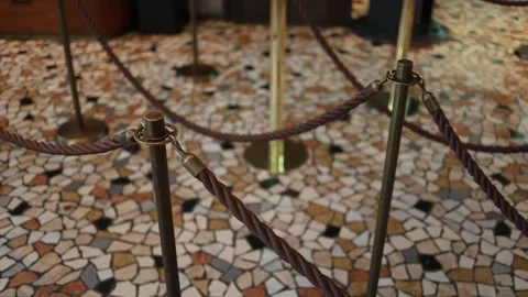 Mosaic floor pattern indoor line divider vintage stanchions warm lighting elegan Stock Footage 310055303