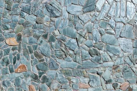 Mosaic green stone wall pattern, front view, background photo Stock Photos