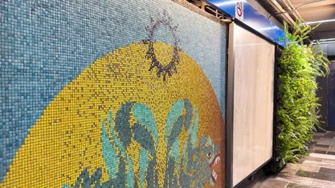 Mosaic Mural and Vertical Garden in Renovated Zocalo Metro Station Stock Footage 345718596