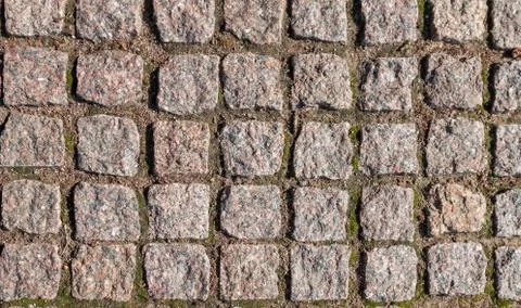 Mosaic pattern of irregular coarse granite stones. floor, texture of pavement Stock Photos