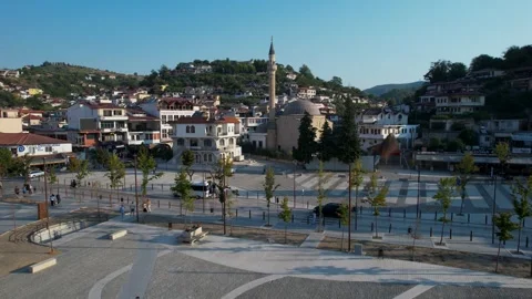 Mosaic pattern plaza surrounded by ancient Berat architecture landmarks in the Stock Footage 345832248
