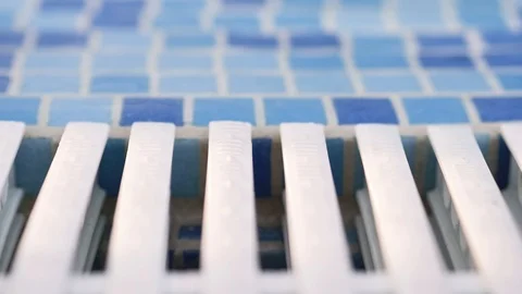 Mosaic side and white grille in blue and white,pool with clear transparent water Stock Footage 122223973