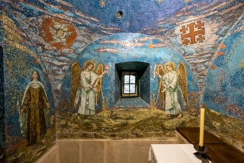 A mosaic in a small chapel with figures of saints and angels in the convent of E Stock Photos