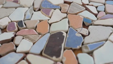 Mosaic of small stones on the table. decorating the table with small pieces of Stock-Footage 149280927