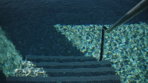 Mosaic steps and infinity edge in Montenegro seaside pool, daytime Stock Footage 329412178