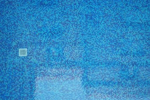 Mosaic tile pattern in a clear swimming pool water Stock Photos