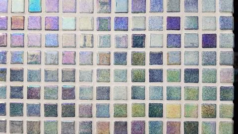 Mosaic tiles arranged in a grid pattern showcase a beautiful range of colors  Stock Photos