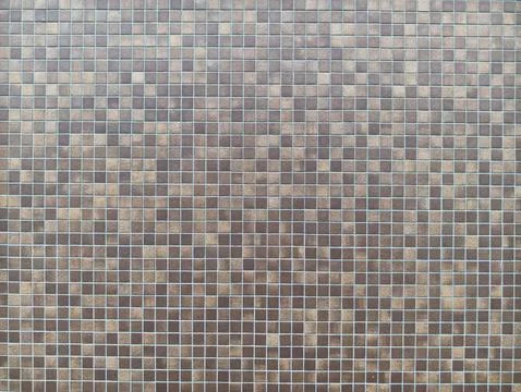 Mosaic tiles form a textured, repeating grid 写真素材