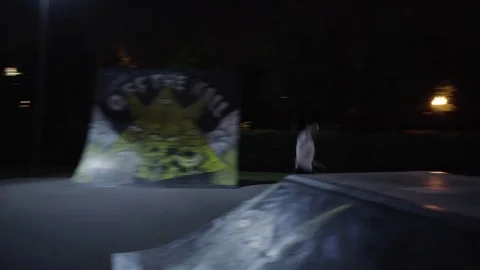 MOSCOW - CIRCA 2017: Roller skating at the skate Park at night. Ramp Stock Footage 80133318