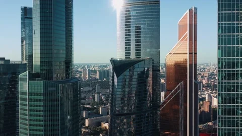Moscow city business centre zoom in, sunny evening with bright sky Stock Footage