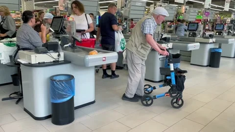 Moscow: Disabled retired elderly man with a walking frame in a grocery store Stock Footage 220152388