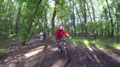 MOSCOW - JUN, 4, 2016: Two women (with model releases) and man riding on path in Stock Footage 83110358