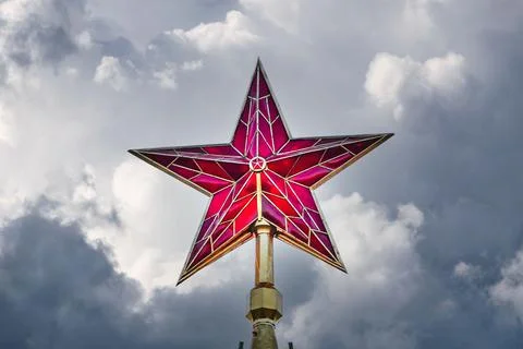 Moscow Kremlin red ruby star in the dark stormy sky Stock Photos