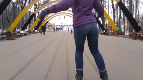 MOSCOW - MAR, 29, 2016: Back of woman (with model release) on roller blade in Stock Footage 80519633