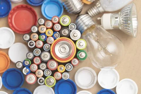 Moscow, May 05 2025, bunch of batteries and a light bulb are scattered on a Stock Photos