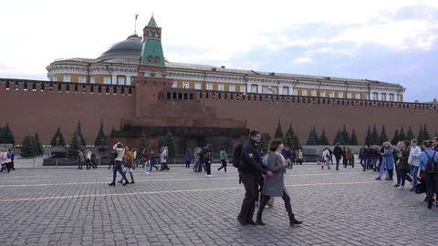 Moscow, red square, Kremlin wall, Lenin mausoleum, people walk on the square Stock Footage 114966385