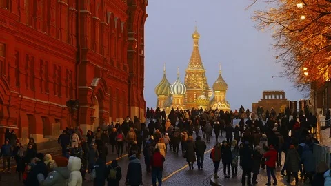 MOSCOW, RUSSIA - December 14, 2017. People walking on Red Square passing the Stock Footage