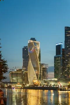 Moscow, Russia. Evolution Tower at blue hour, its spiraling glass facade tw.. Photos