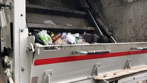 Moscow, Russia - July 2019: garbage truck picks up garbage on the street Stock Footage 112890053