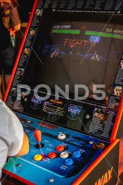MOSCOW, RUSSIA - JULY 27, 2019: Man playing Mortal Combat on a retro game Stock Photos