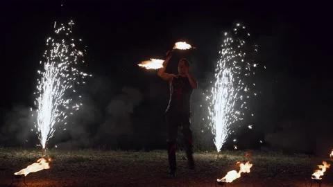Moscow, Russia - June 1, 2021. Portrait of fire show artist with burning stick Stock Footage 166380472