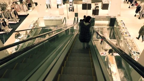 MOSCOW, RUSSIA - MARCH, 21, 2017. Moving staircases at modern shopping mall Stock Footage