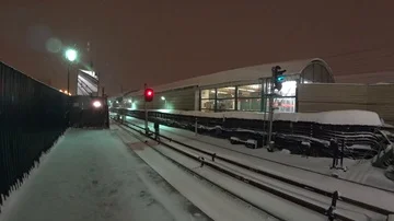 Moscow subway train come to an open station in the winter Stock Footage 85468795