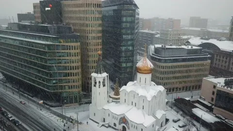 Moscow winter white square snowfall drop shot from the air church Stock Footage 218629597