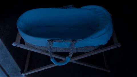 Moses basket in the moon light. Stock Photos