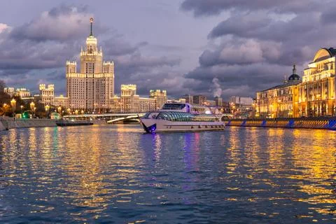 Moskva river night view and a touristic boat cruising Stock Photos