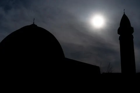 Mosque against the sky with the sun Stock Photos
