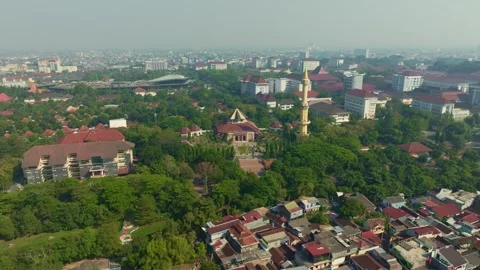 Mosque and minaret surrounded by green Yogyakarta urban landscape Stock Footage 342581502